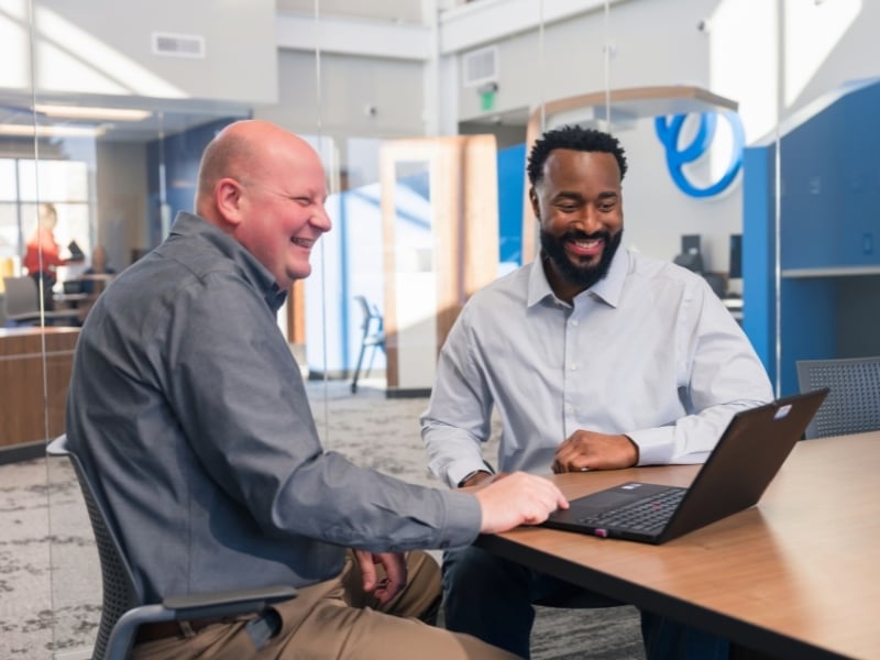 Happy business member meeting with Magnifi.