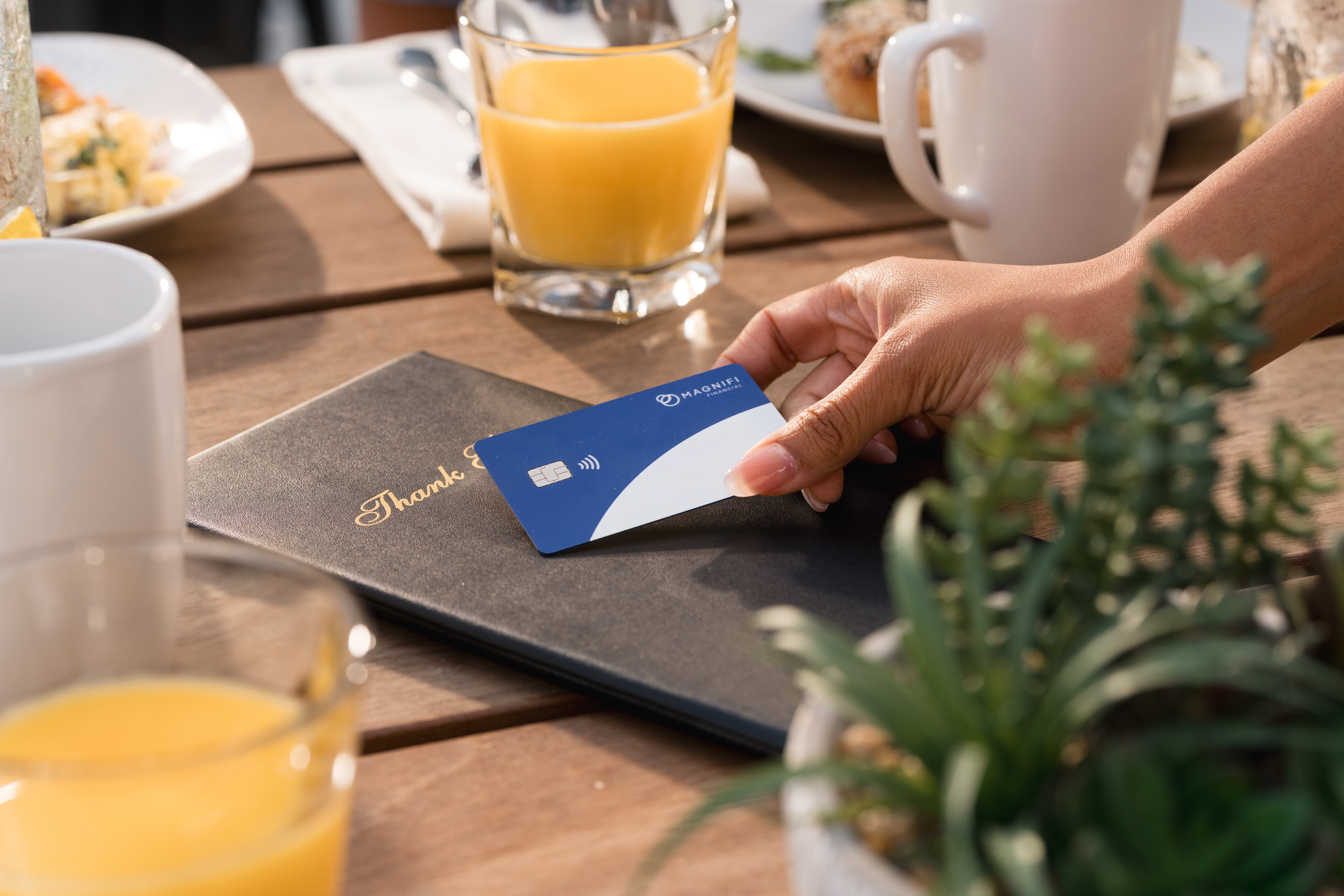 Using Magnifi card to pay at brunch.