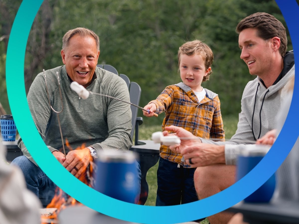 Three generations enjoying smores.