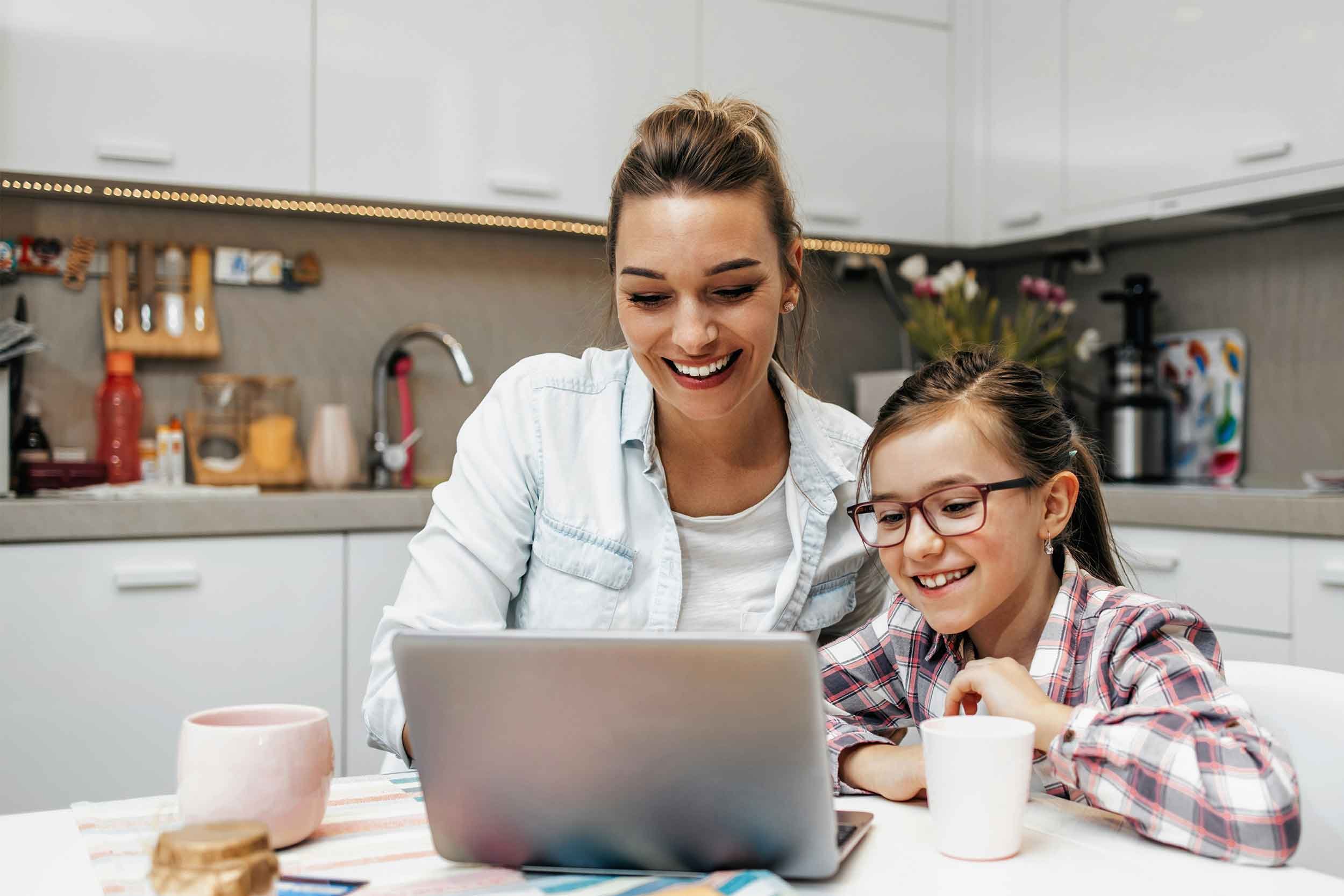 Happy mom and daughter checking out Greenlight.