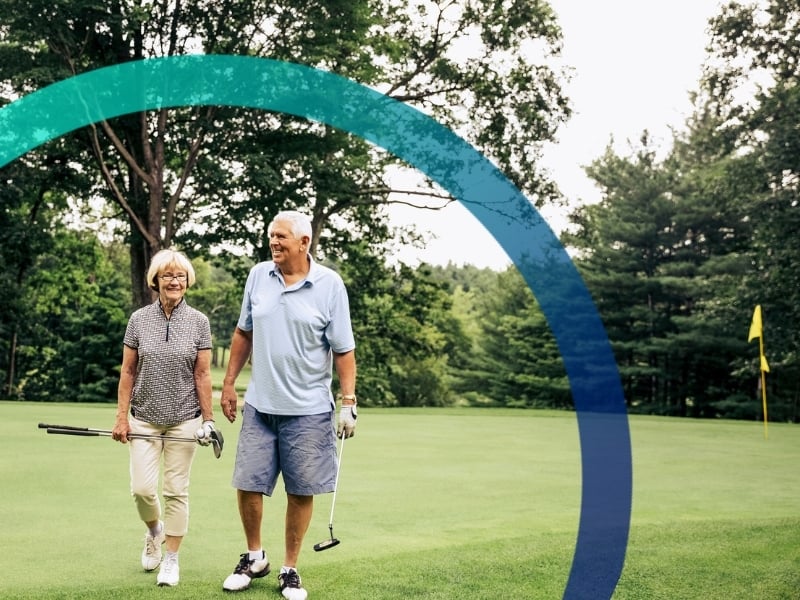 Happy couple playing golf.